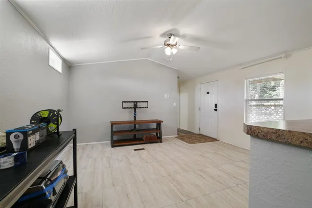 a bedroom with furniture and a window