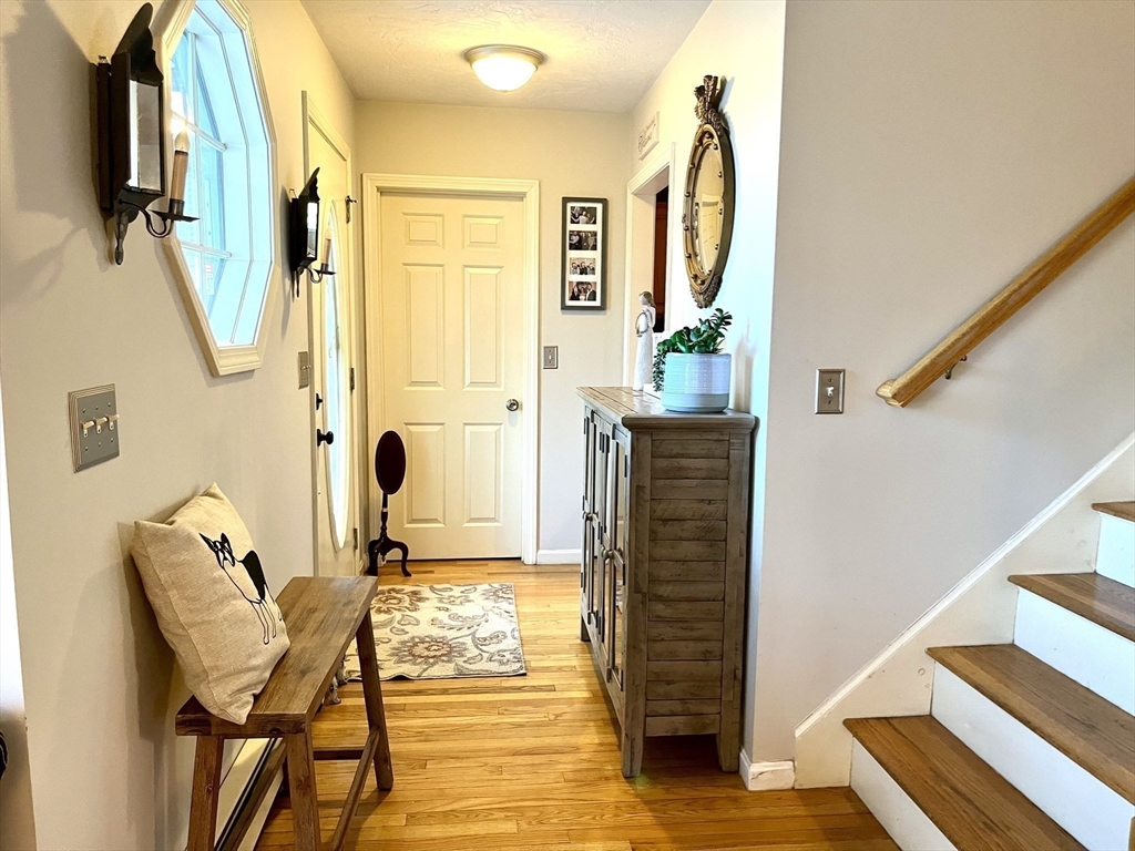 2 Pierce Circle Paxton, MA 01612 - Photo 14 of 31 a view of a hallway with wooden floor and staircase