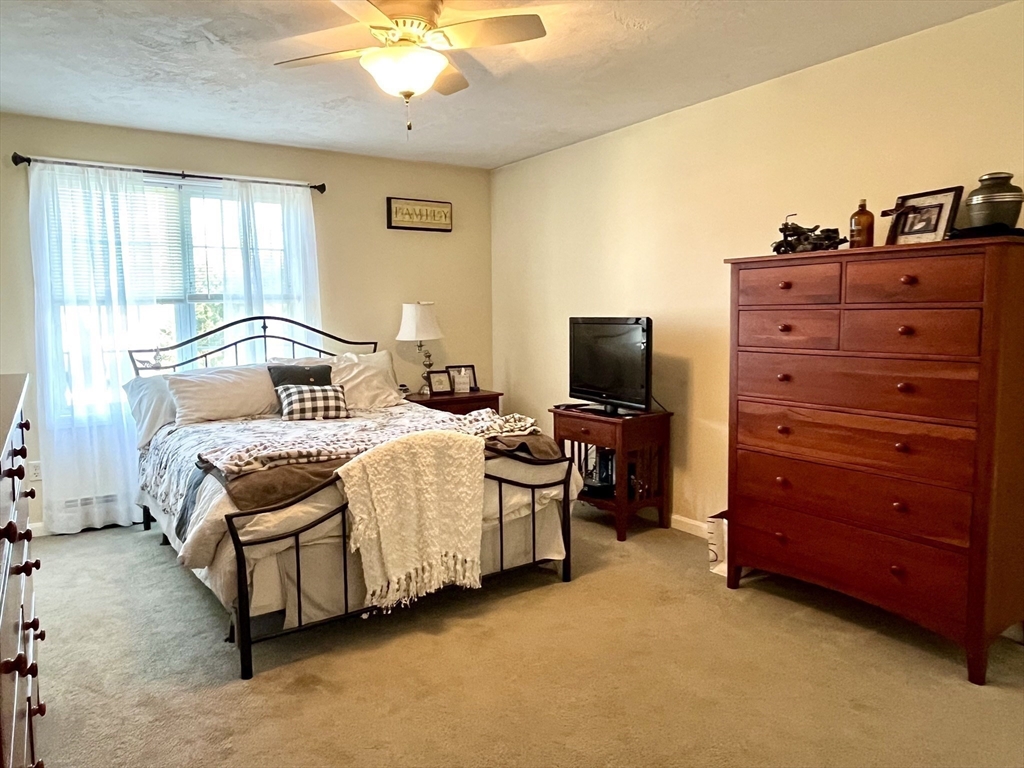 2 Pierce Circle Paxton, MA 01612 - Photo 16 of 31 a bedroom with a bed and a chandelier