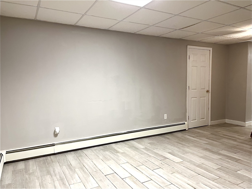 2 Pierce Circle Paxton, MA 01612 - Photo 26 of 31 an empty room with a wooden floor and white walls