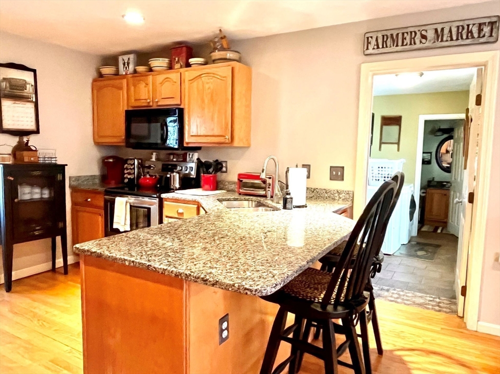 2 Pierce Circle Paxton, MA 01612 - Photo 10 of 31 a dining room with furniture and a flat screen tv