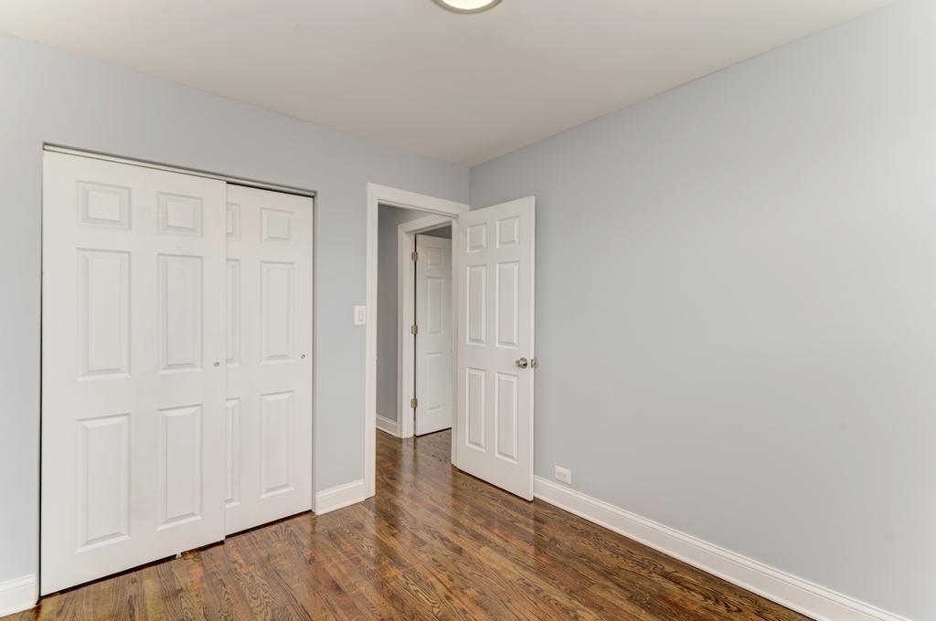 1411 West 114th Place Chicago, IL 60643 - Photo 15 of 25 a view of an empty room and wooden floor
