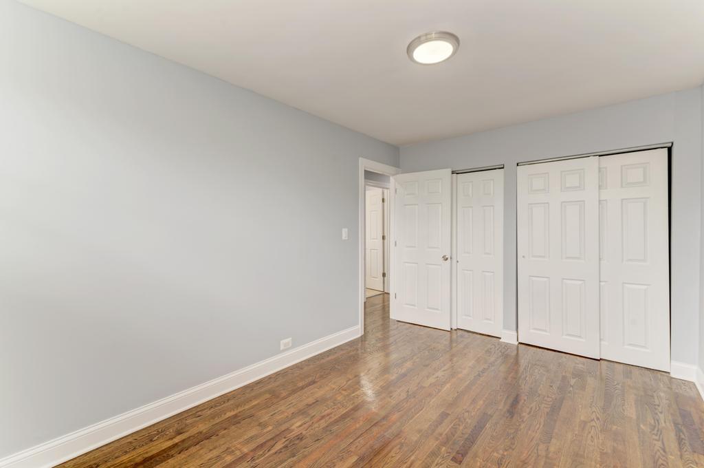 1411 West 114th Place Chicago, IL 60643 - Photo 17 of 25 a view of an empty room with wooden floor