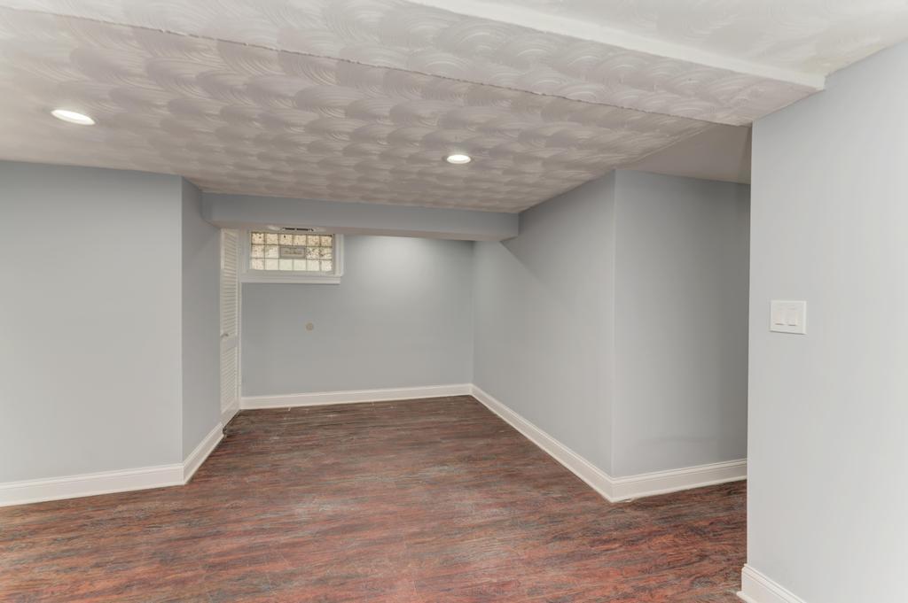 1411 West 114th Place Chicago, IL 60643 - Photo 19 of 25 an empty room with wooden floor and windows