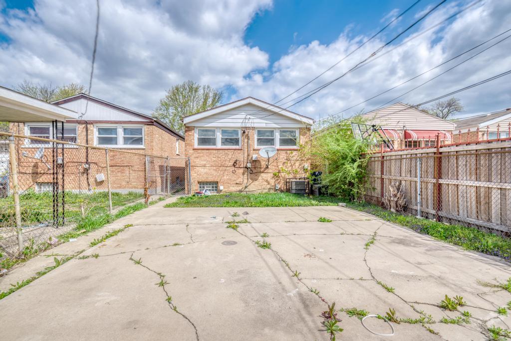 1411 West 114th Place Chicago, IL 60643 - Photo 24 of 25 a front view of a house with garden