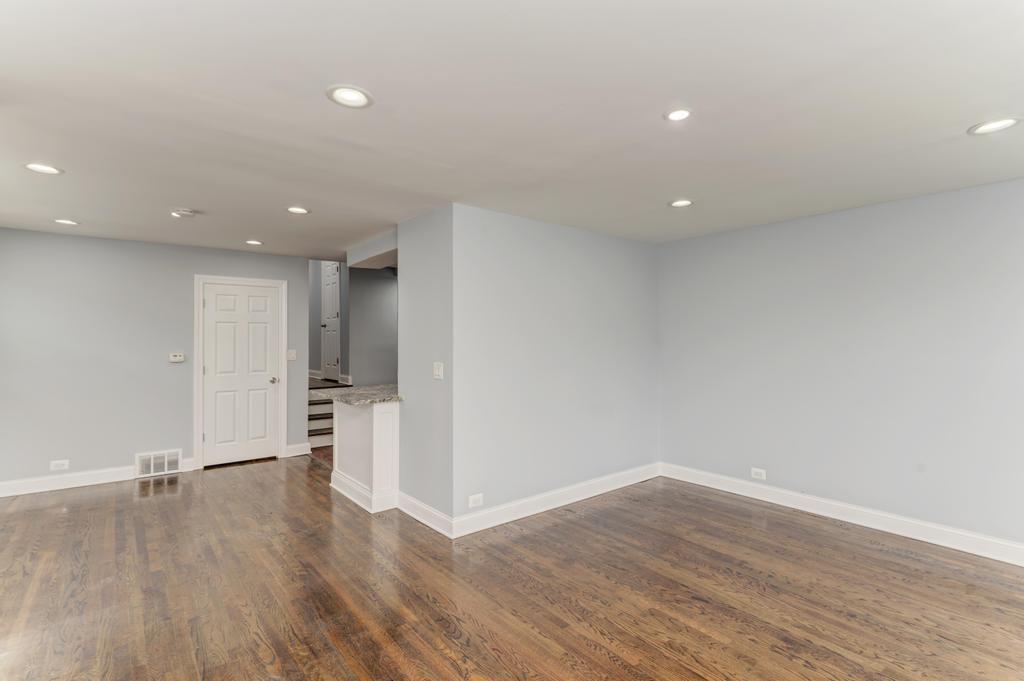 1411 West 114th Place Chicago, IL 60643 - Photo 6 of 25 a view of empty room with wooden floor