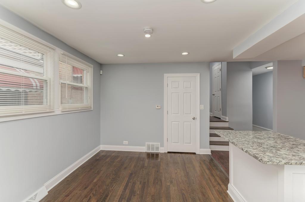 1411 West 114th Place Chicago, IL 60643 - Photo 7 of 25 a view of a kitchen cabinets and wooden floor