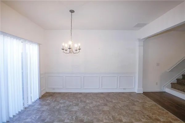 a view of a chandelier fan in a room