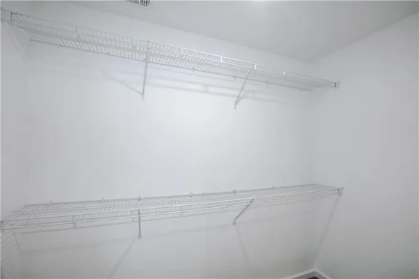 a view of a room with racks on the wall