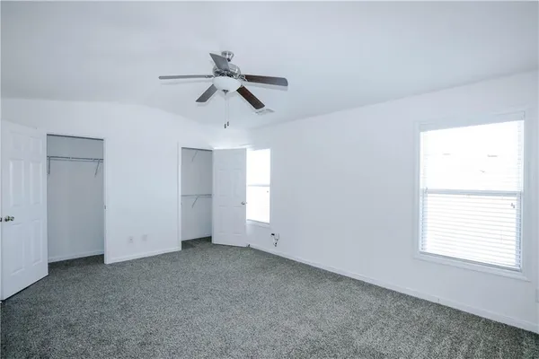 a view of empty room with windows