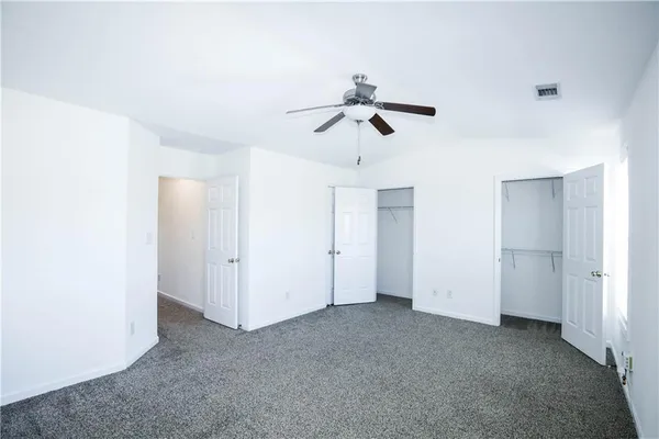 a view of room with ceiling fan