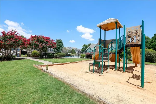 a view of a park with swings and slides
