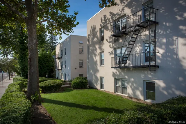 a large building with a trees in front of it