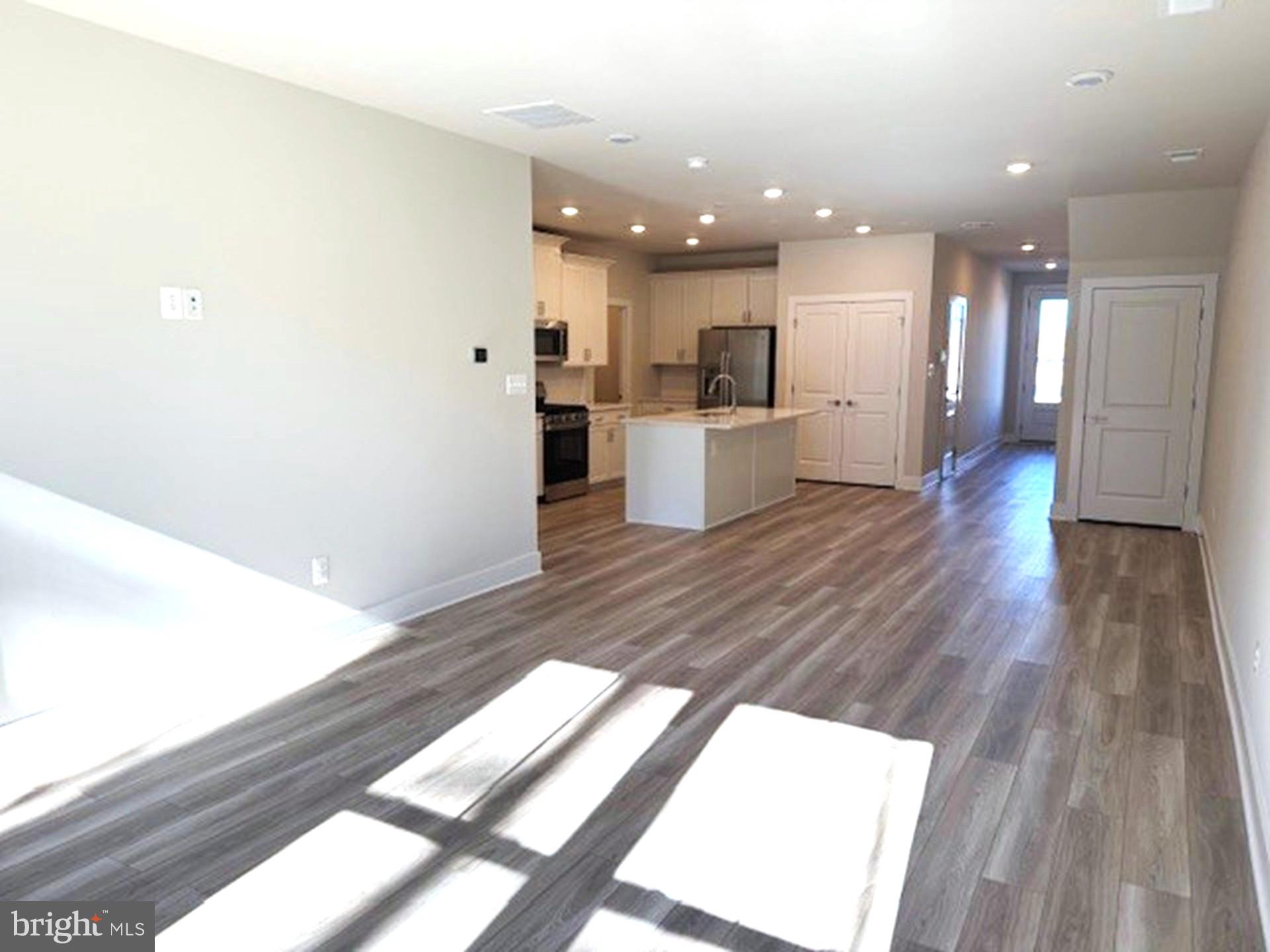 185 Merrick Way Ocean View, DE 19970 - Photo 4 of 19 a view of a kitchen with wooden floor