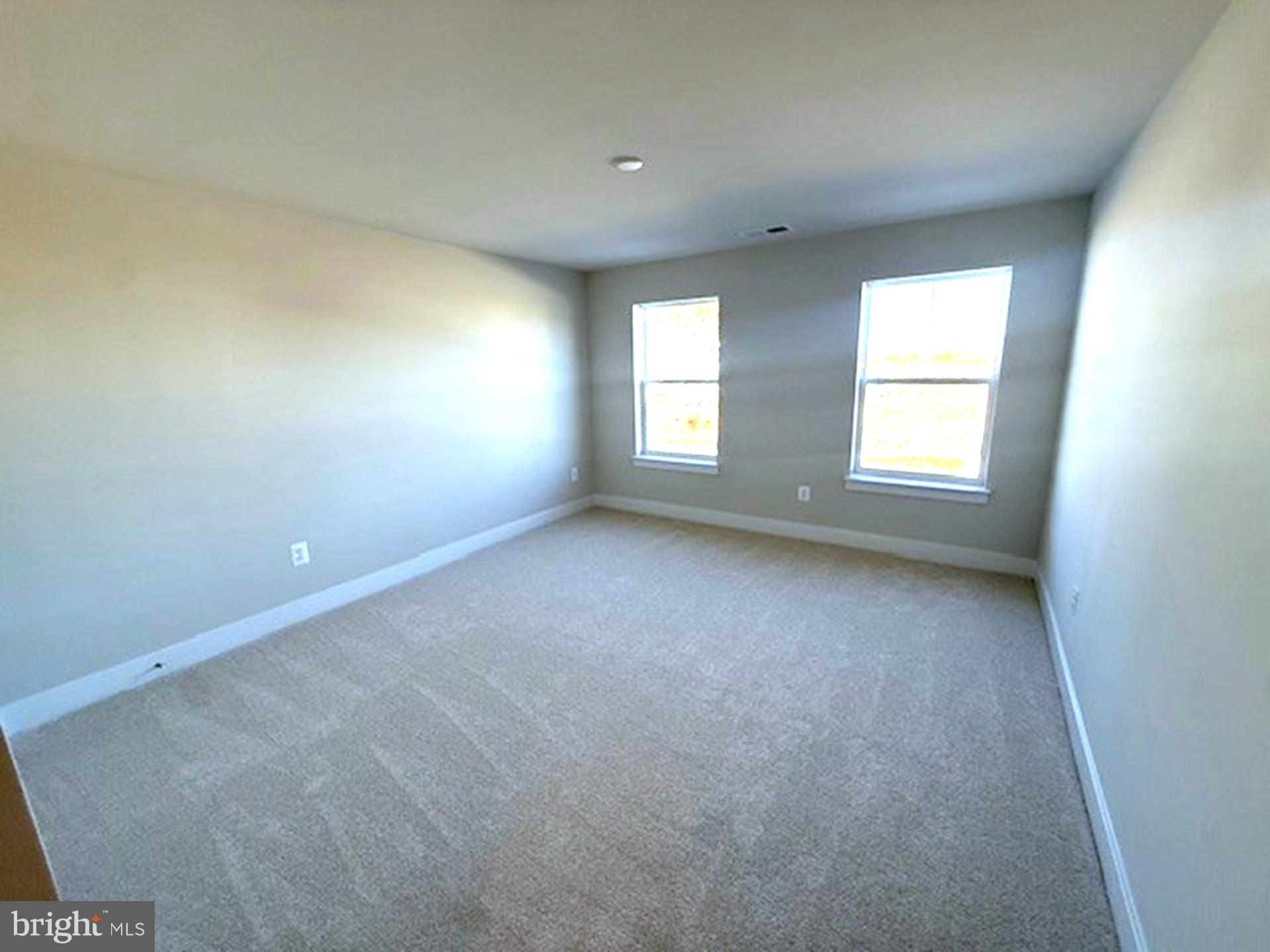 185 Merrick Way Ocean View, DE 19970 - Photo 7 of 19 an empty room with windows