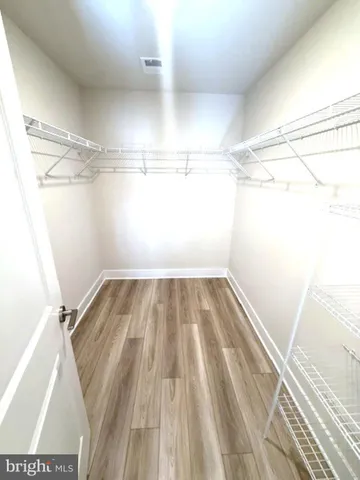 a view of a room with racks on the wall