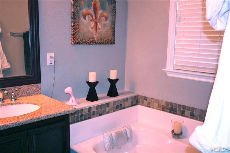 8435 Ranger Lane Chino, CA 91708 - Photo 14 of 40 a bathroom with a sink and a mirror