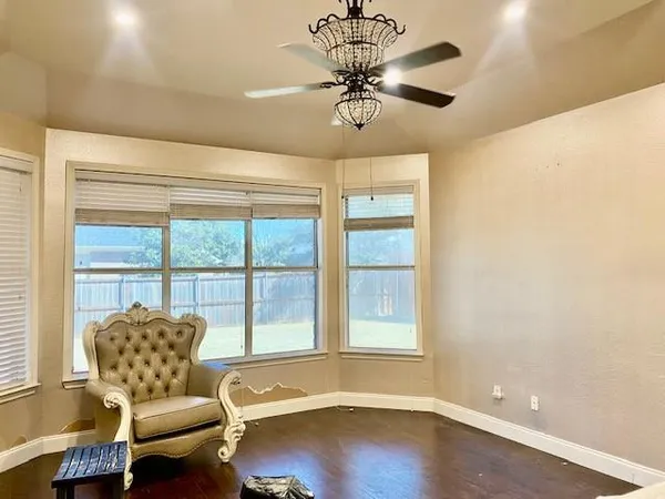 a living room with furniture and a window