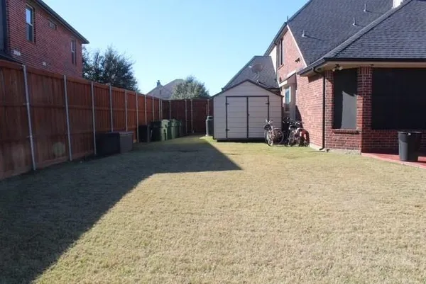 a view of a barn in front of house