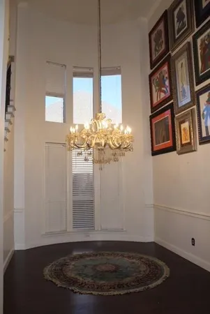 a view of a chandelier fan in a room