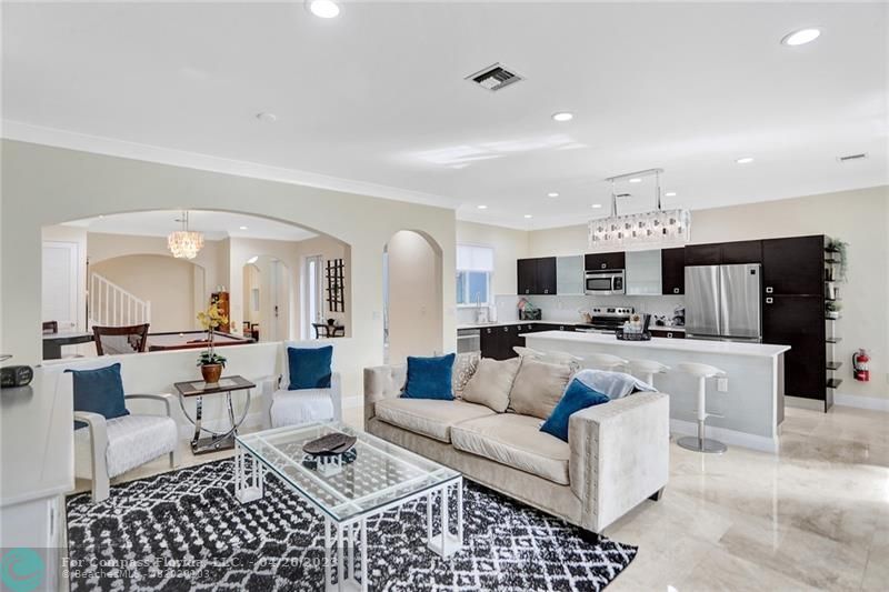 820 Himmarshee Street Fort Lauderdale, FL 33312 - Photo 1 of 47 a living room with furniture a rug and white walls