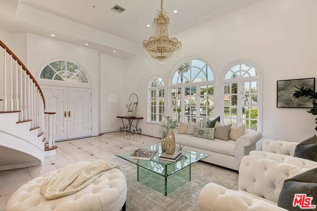 138 North Carson Road Beverly Hills, CA 90211 - Photo 4 of 22 a living room with furniture chandelier and a chandelier
