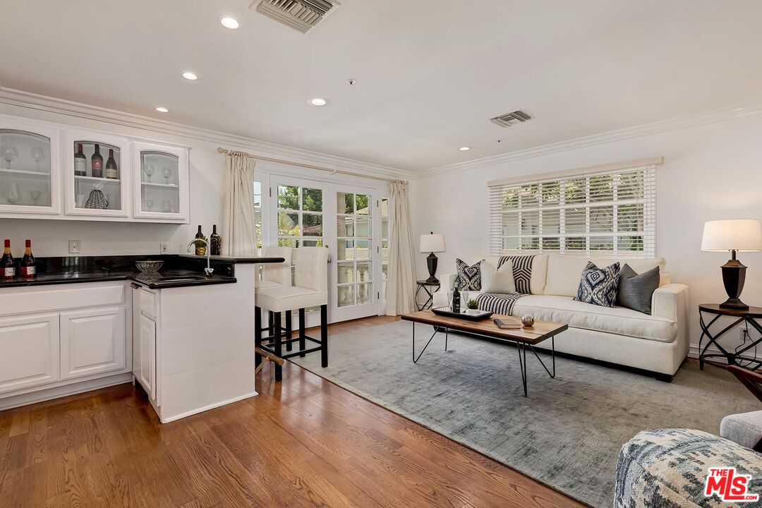 138 North Carson Road Beverly Hills, CA 90211 - Photo 7 of 22 a living room with furniture and a window