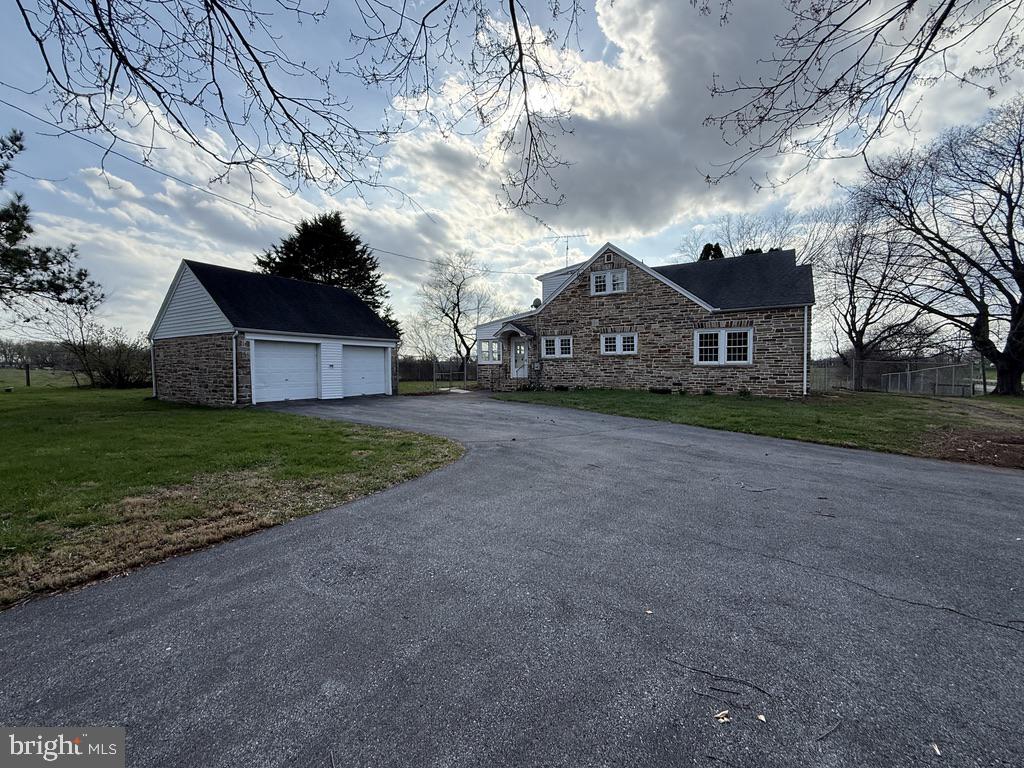 6245 Middleburg Road Keymar, MD 21757 - Photo 10 of 77 a front view of a house with a yard and garage