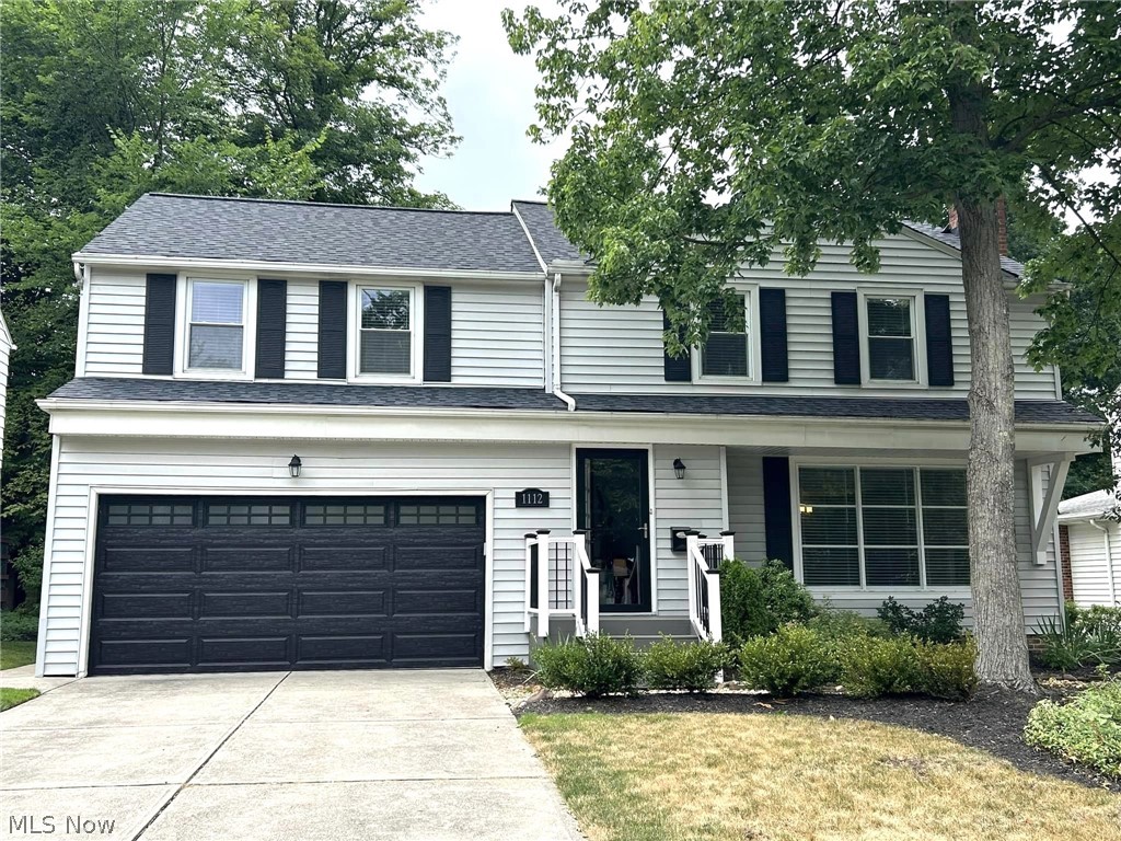 1112 Brainard Road Lyndhurst, OH 44124 - Photo 1 of 34 Front facade featuring a garage and a front yard