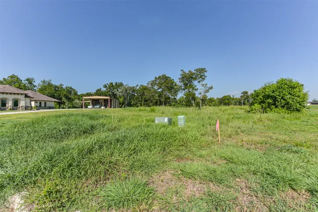 a view of a garden with a building in the background
