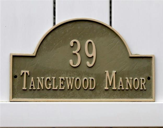 39 Main Street, Unit 31 Bethel, CT 06801 - Photo 1 of 1 a blue sign that is on the side of a building