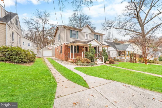 a front view of a house with a yard table and chairs
