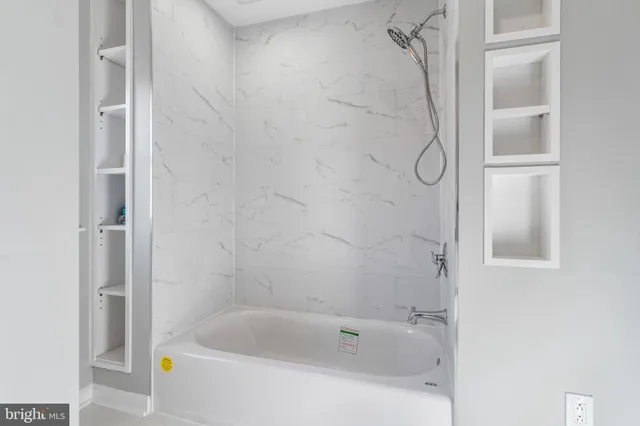 a bathroom with a shower and a bathtub