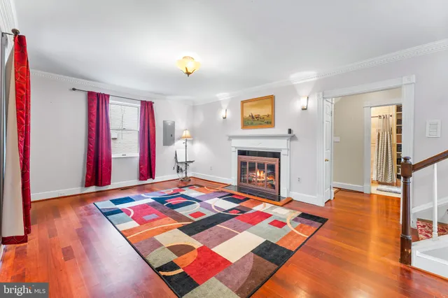 a bedroom with a bed and a fireplace