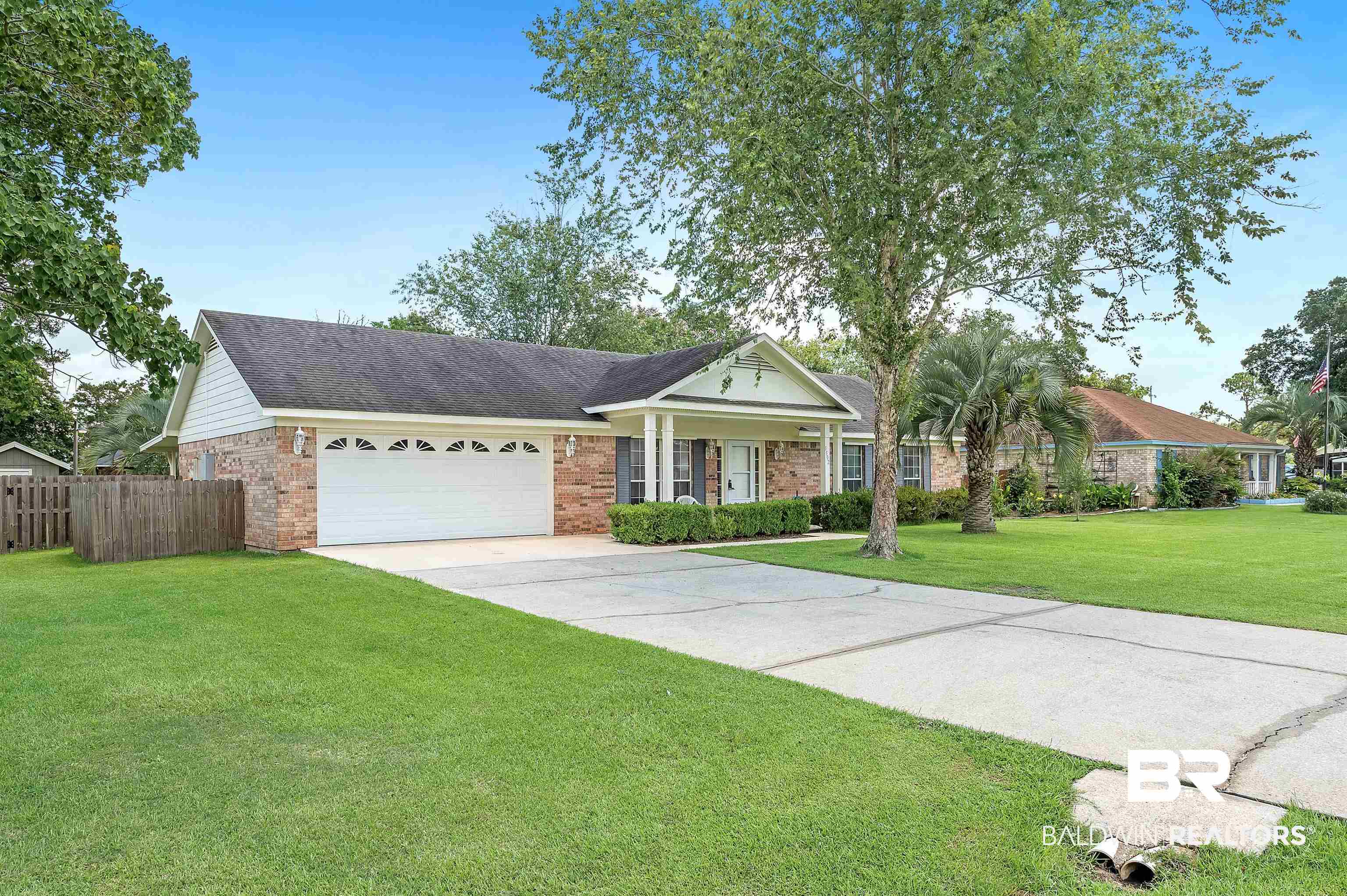 1502 Mulberry Lane Foley, AL 36535 - Photo 1 of 45 Single story home featuring a garage and a front yard