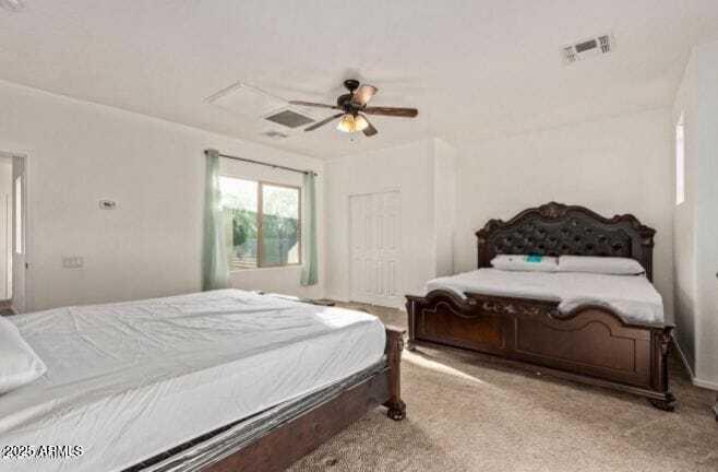 9171 West Berkeley Road Phoenix, AZ 85037 - Photo 11 of 13 a bedroom with a bed ceiling fan and a window