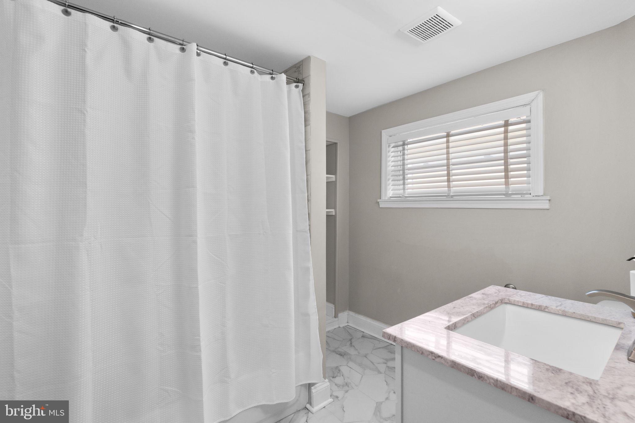 1827 Bank Street Baltimore, MD 21231 - Photo 17 of 31 Serene bathroom with modern touches.