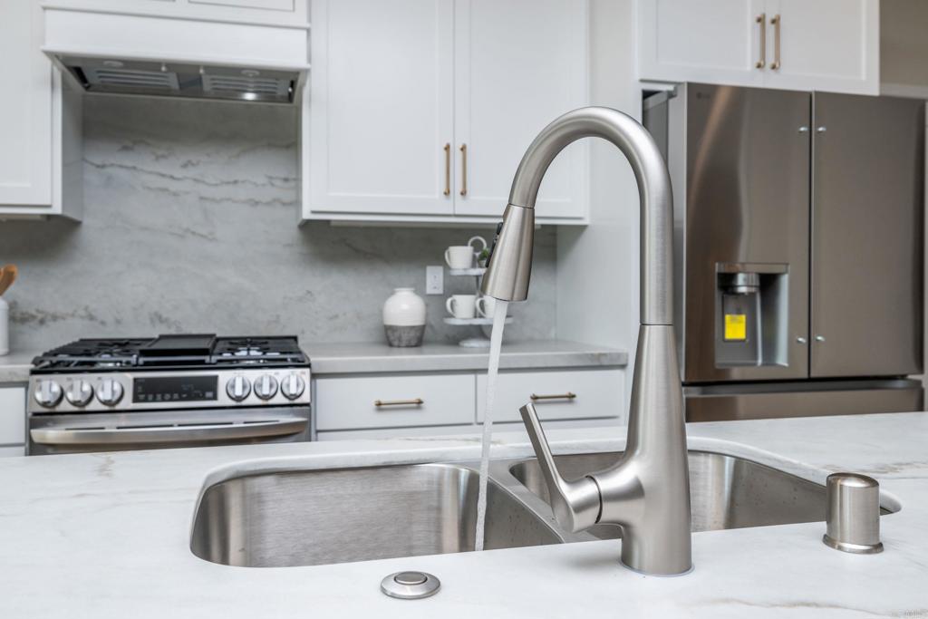 1904 Grey Rabbit Hollow Lane Fallbrook, CA 92028 - Photo 20 of 67 a kitchen with stainless steel appliances granite countertop a sink and a stove