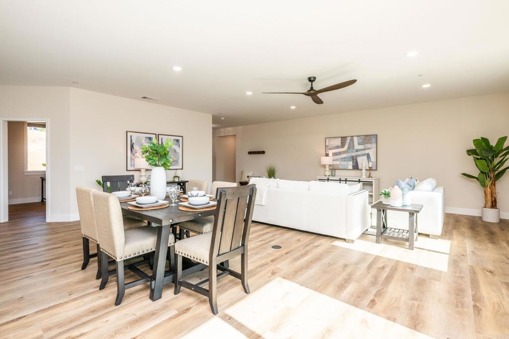 1904 Grey Rabbit Hollow Lane Fallbrook, CA 92028 - Photo 28 of 67 a living room with dining room and wooden floor