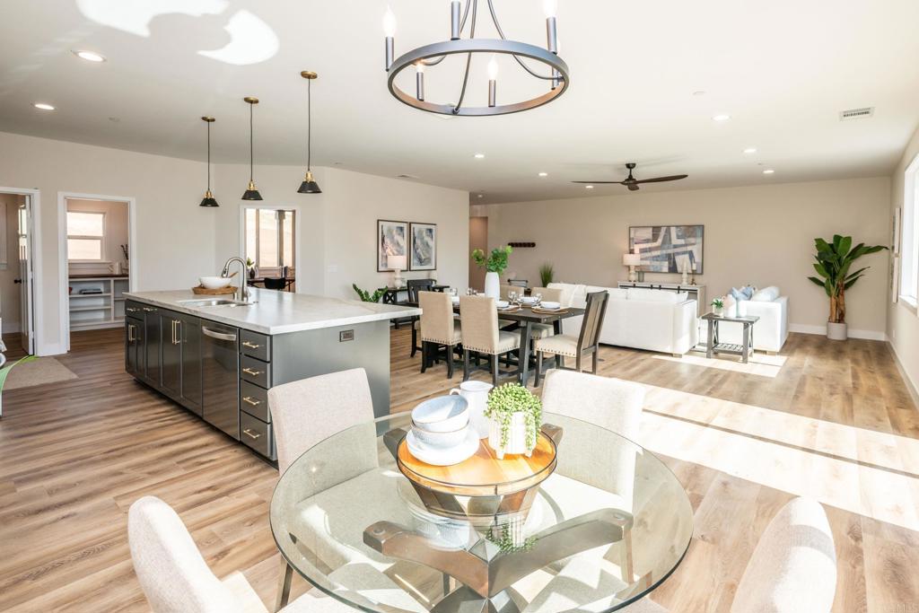 1904 Grey Rabbit Hollow Lane Fallbrook, CA 92028 - Photo 30 of 67 a living room with dining room a table and kitchen view