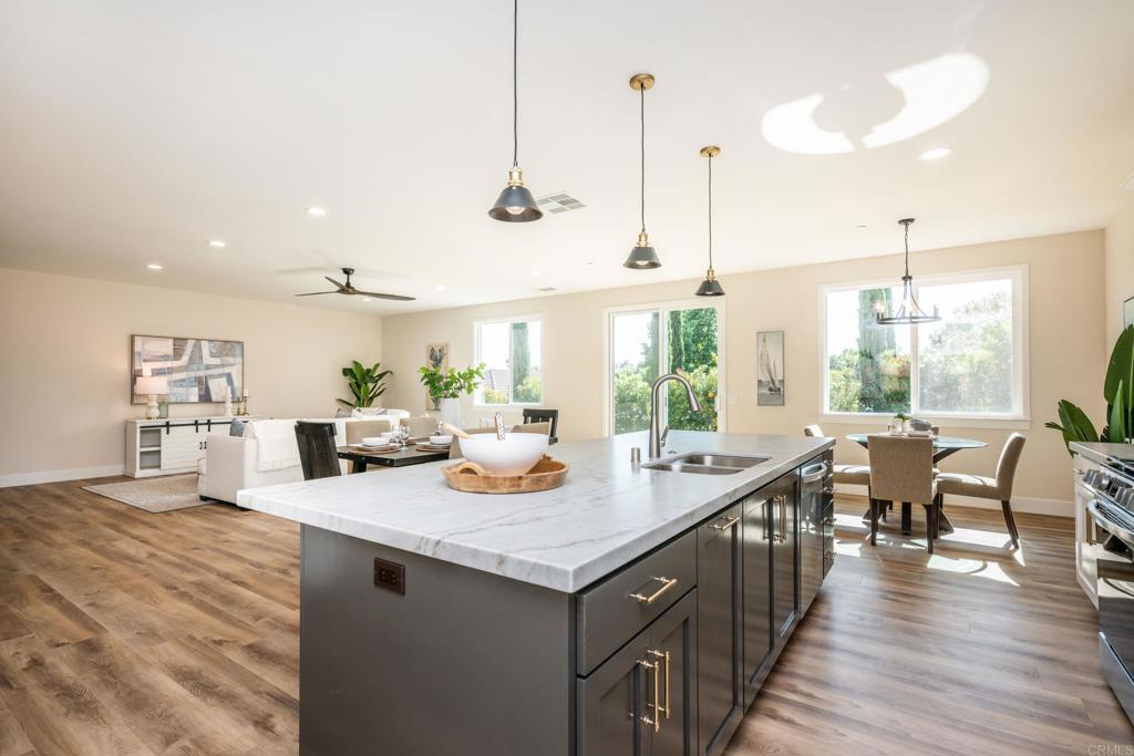 1904 Grey Rabbit Hollow Lane Fallbrook, CA 92028 - Photo 31 of 67 a open kitchen with sink cabinets and wooden floor