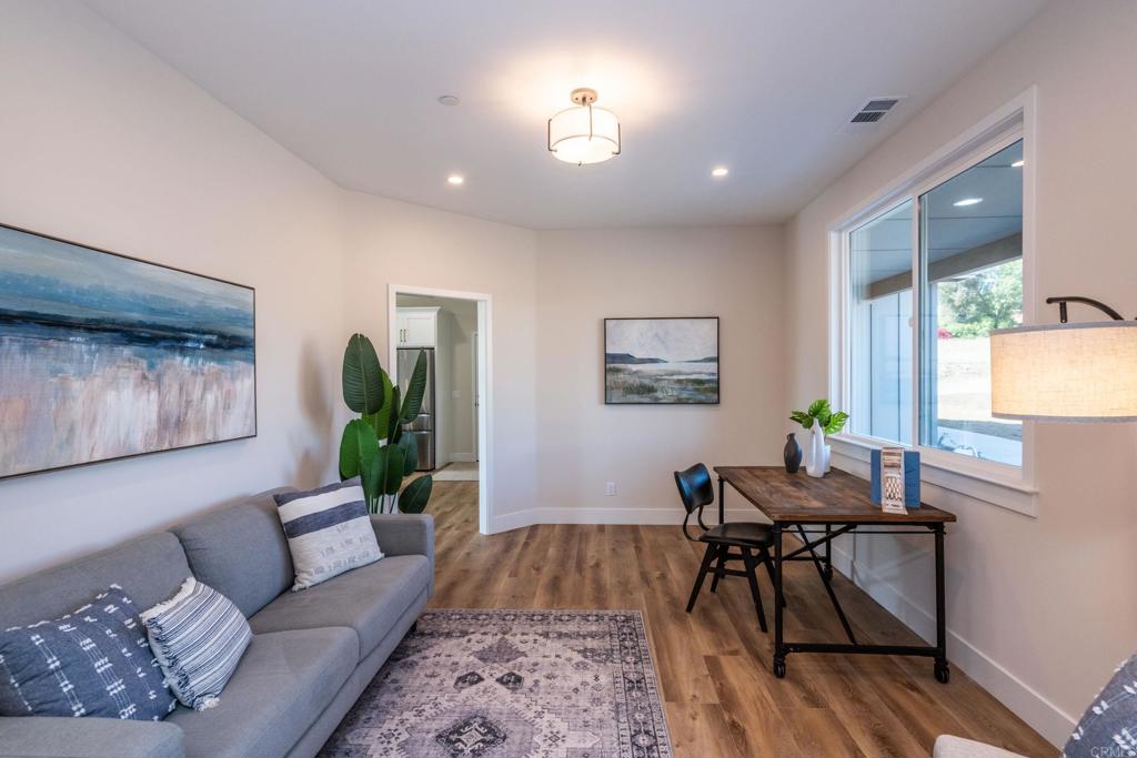 1904 Grey Rabbit Hollow Lane Fallbrook, CA 92028 - Photo 36 of 67 a living room with furniture and a wooden floor