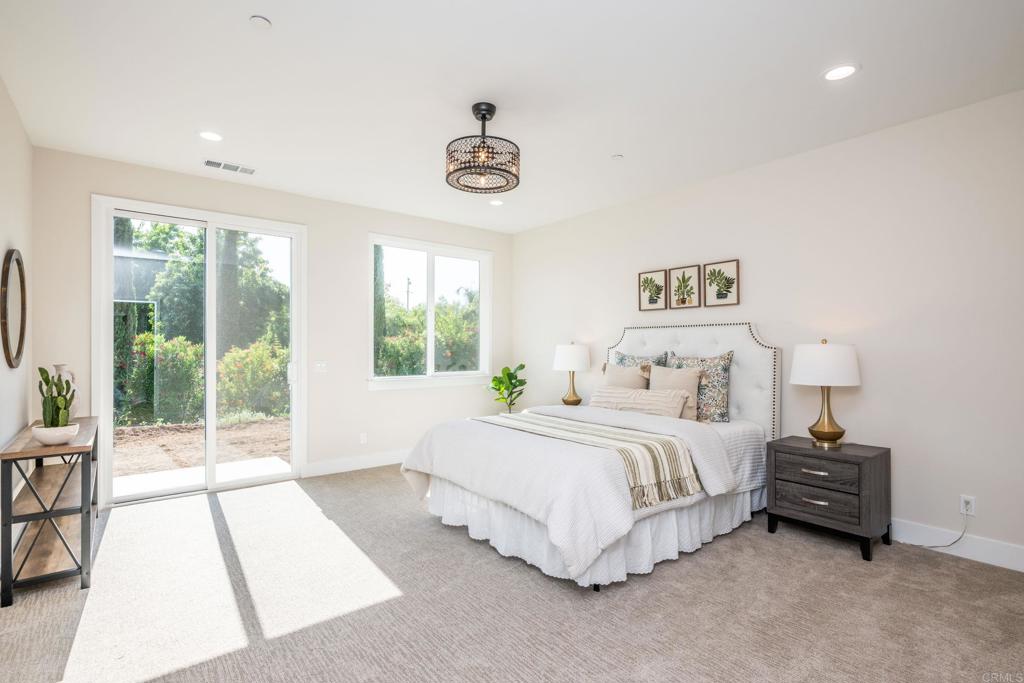 1904 Grey Rabbit Hollow Lane Fallbrook, CA 92028 - Photo 40 of 67 a spacious bedroom with a bed and a large window