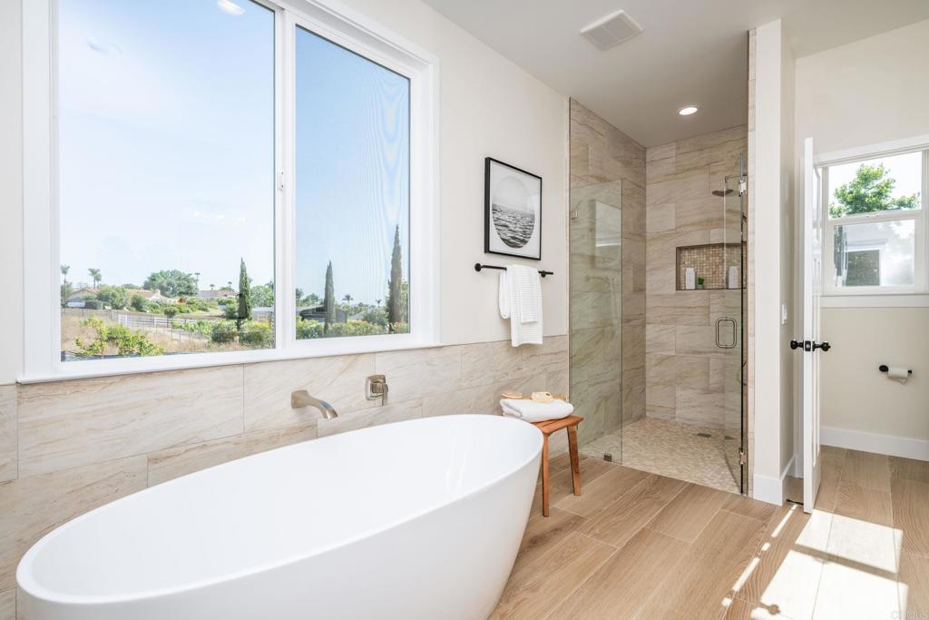 1904 Grey Rabbit Hollow Lane Fallbrook, CA 92028 - Photo 45 of 67 a bathroom with a bathtub and a shower