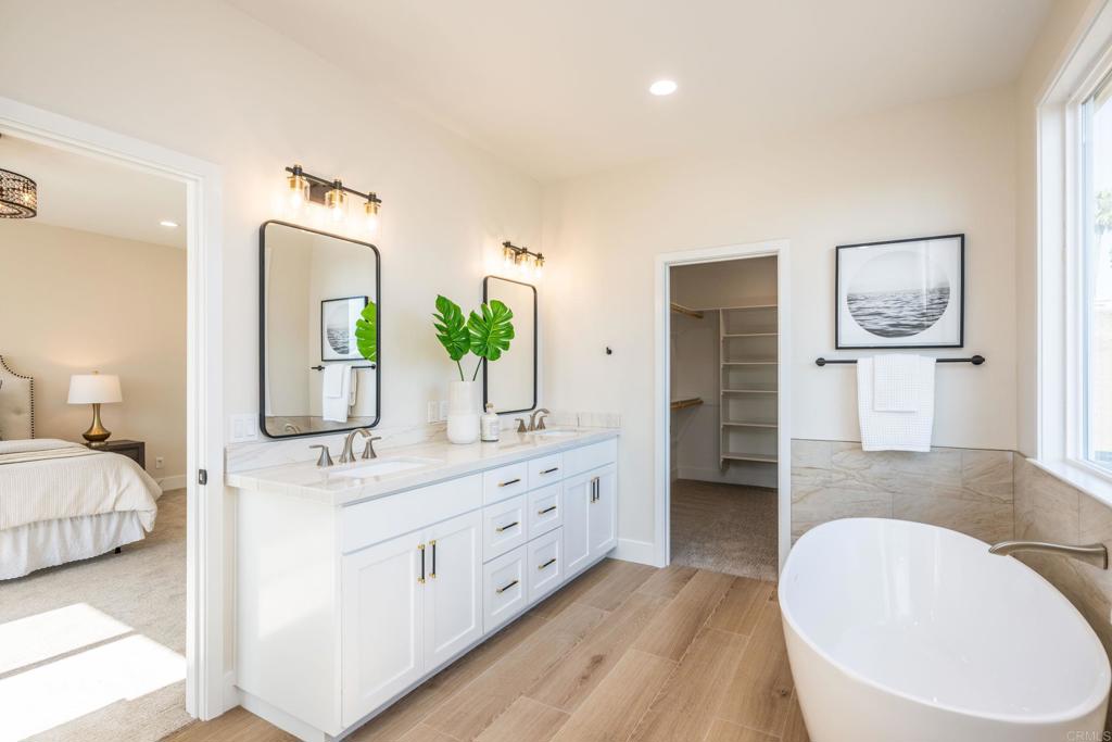 1904 Grey Rabbit Hollow Lane Fallbrook, CA 92028 - Photo 52 of 67 a en suite bathroom with double vanity sinks and a bathtub
