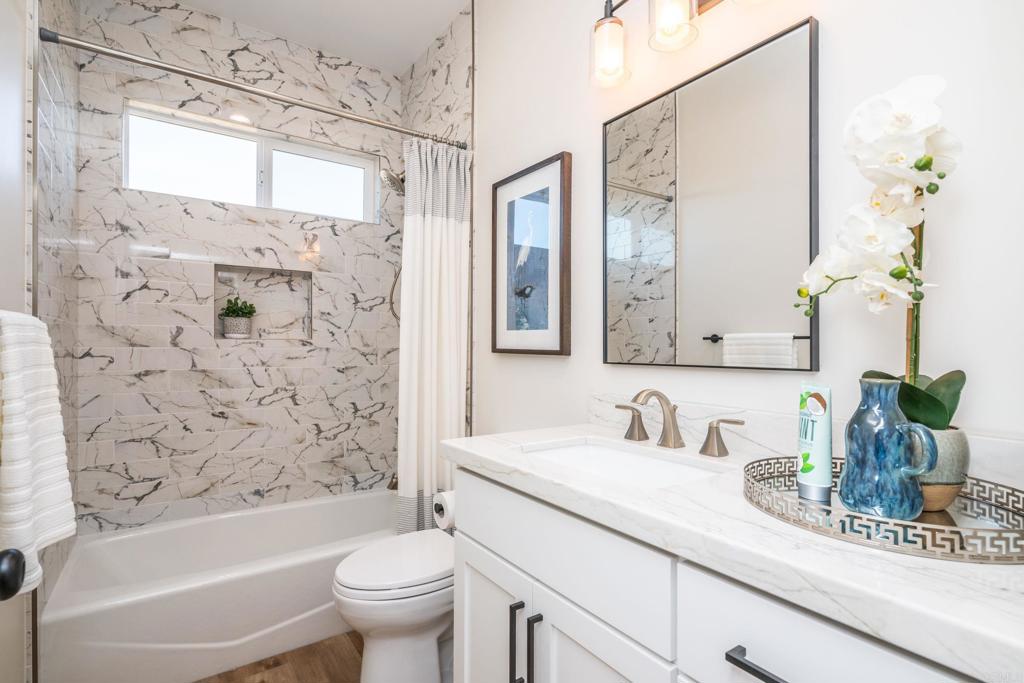 1904 Grey Rabbit Hollow Lane Fallbrook, CA 92028 - Photo 54 of 67 a bathroom with a granite countertop sink a toilet and a mirror