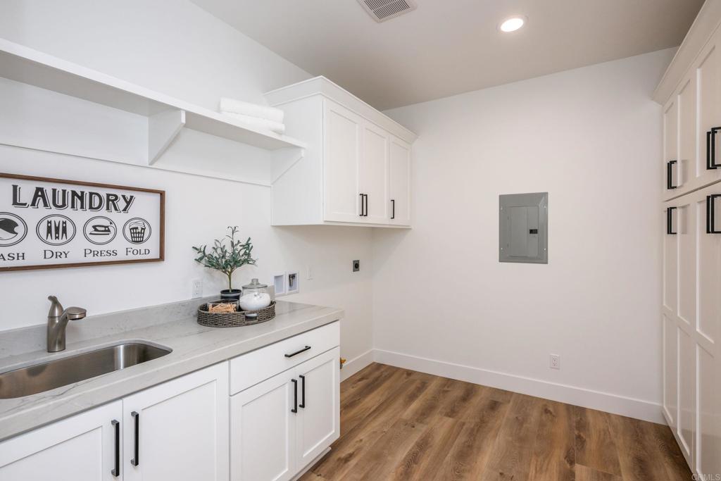 1904 Grey Rabbit Hollow Lane Fallbrook, CA 92028 - Photo 56 of 67 a kitchen with a sink and cabinets