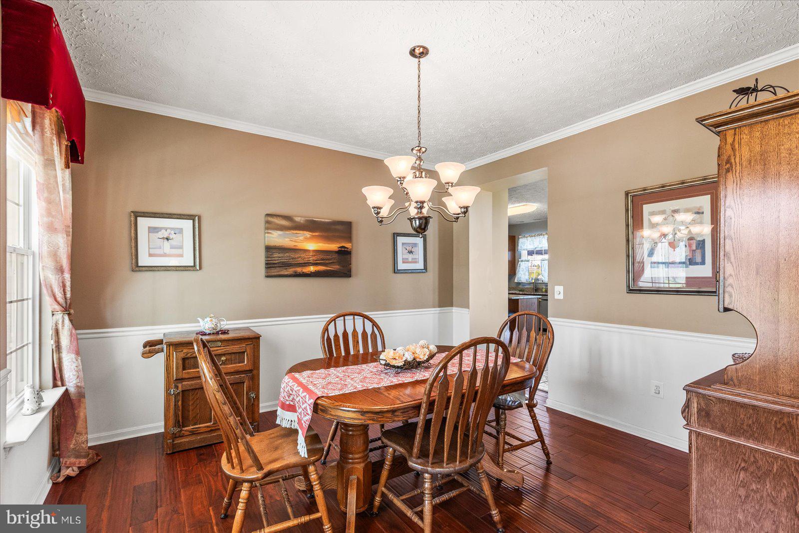 20 Sydney Drive Hanover, PA 17331 - Photo 13 of 73 a view of a dining room with furniture wooden floor and a chandelier