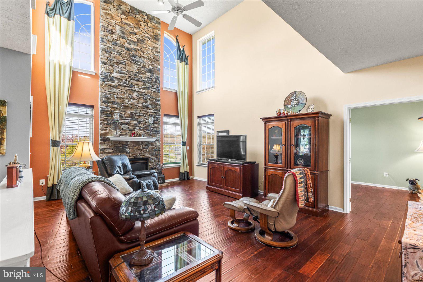 20 Sydney Drive Hanover, PA 17331 - Photo 20 of 73 a living room with furniture floor to ceiling window and wooden floor