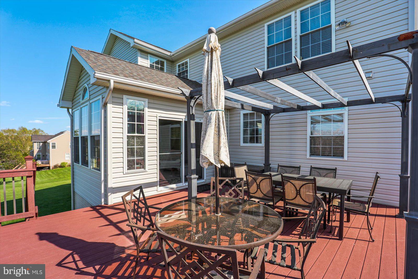 20 Sydney Drive Hanover, PA 17331 - Photo 63 of 73 a view of a patio with table and chairs with wooden floor and fence